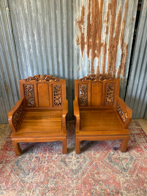 A pair of Chinese carved hardwood armchairs