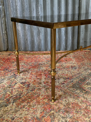 A brass and glass Hollywood Regency coffee table