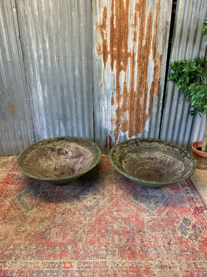 A pair of large modernist cast stone conical planters