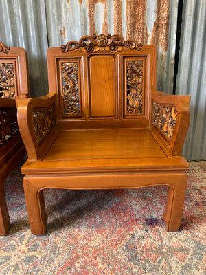 A pair of Chinese carved hardwood armchairs