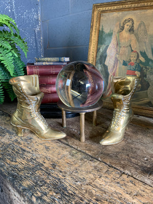 A very large fortune teller's crystal ball on a stand
