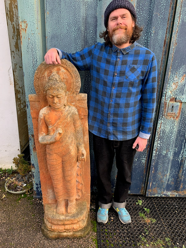 A large cast stone Buddha statue Belle and Beast Emporium