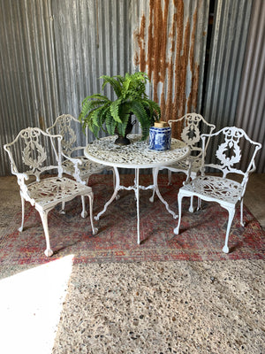 A white Regency style table and four chairs garden set