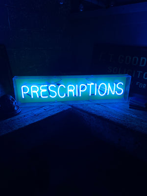A large original ‘prescriptions’ neon sign