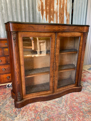 A Victorian double fronted serpentine pier cabinet