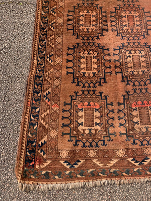 A Persian brown ground rectangular rug- 218cm x 115cm
