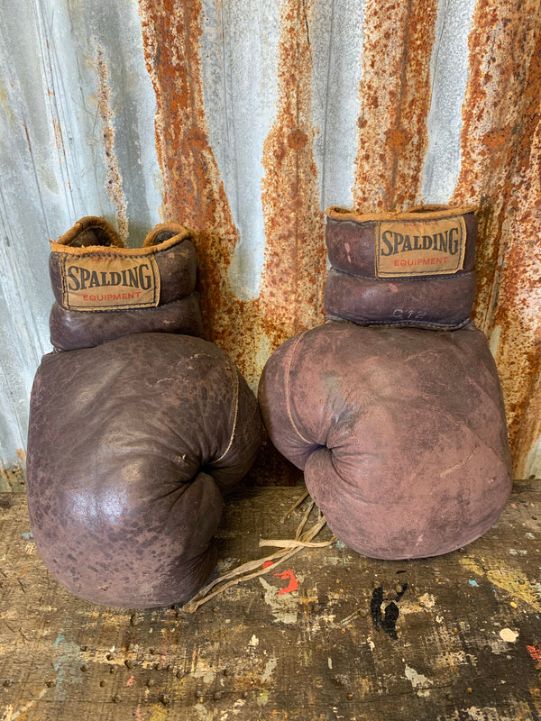 A vintage pair of brown leather Spalding boxing gloves - Belle and