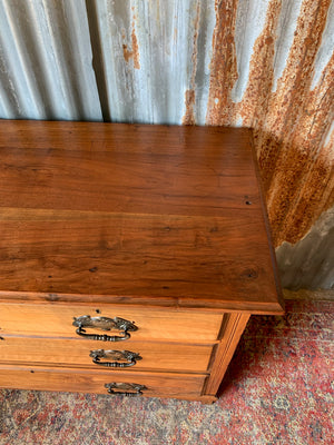 An Art Nouveau chest of drawers