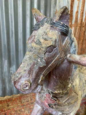 Carved wooden rocking horse