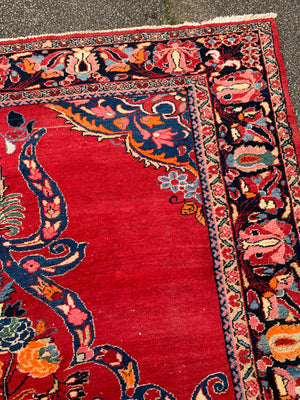 A very large rectangular red ground Persian floral rug ~ 12ft x 8ft