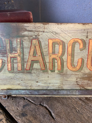 A French ‘charcuterie’ sign with hanging rack