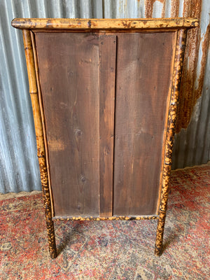 A tiger bamboo display cabinet