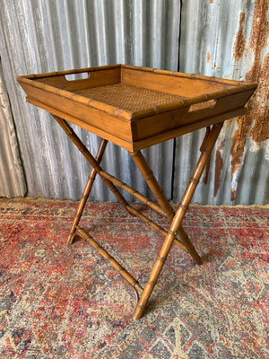 A faux bamboo butler's tray table