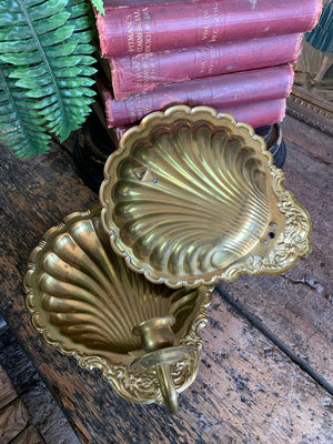 A pair of large brass shell candlestick wall sconces