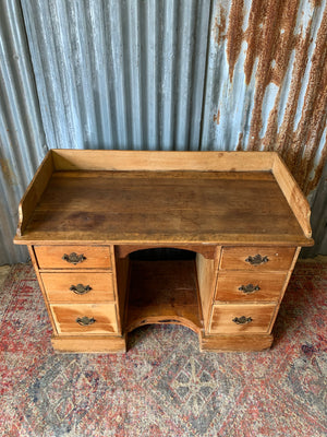 A pine clerk's desk with galleried top