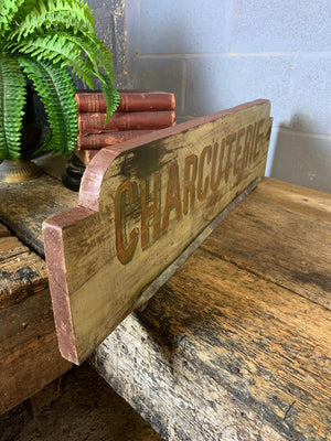 A French ‘charcuterie’ sign with hanging rack