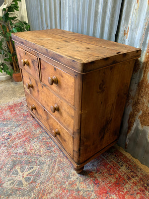 A pine chest of two over two drawers