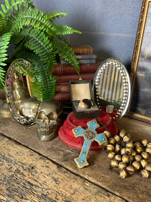 A set of oversized wooden rosary beads with eye motif