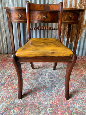 A serpentine desk and leather chair by Bevan Funnell