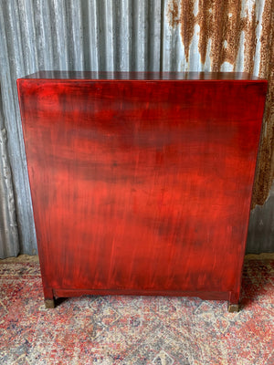 A red and gold lacquered chinoiserie cabinet