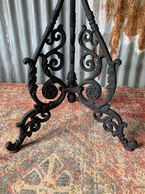 A black cast iron pub table