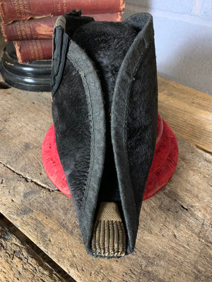 A Royal Navy bicorn hat in monogrammed tin