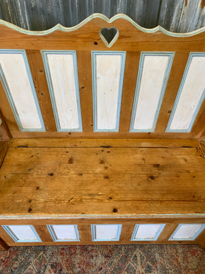 A pine storage settle