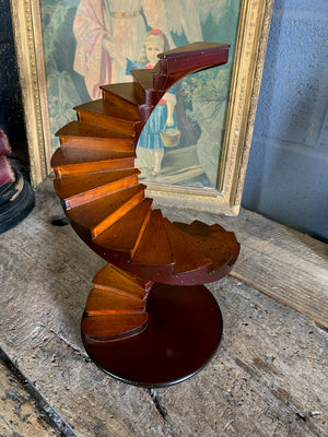 A wooden spiral staircase model