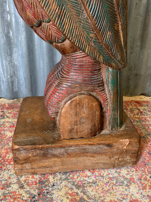 A very large carved wooden polychrome parrot statue