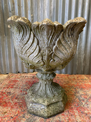 A pair of large acanthus cast stone urns