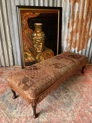 A large Persian carpet footstool