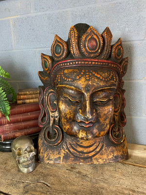 A very large hand-carved bodhisattva head