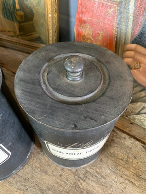 A set of three lidded wooden apothecary jars