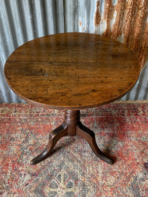 A Georgian oak tilt top table