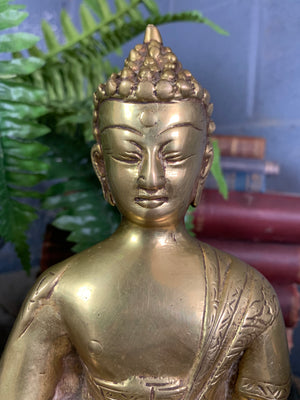 A bronze seated Buddha figure