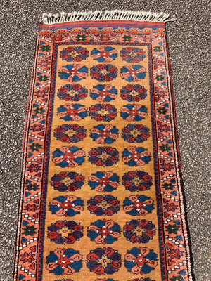 A long yellow ground red blue Persian runner rug ~ 257cm x 67cm