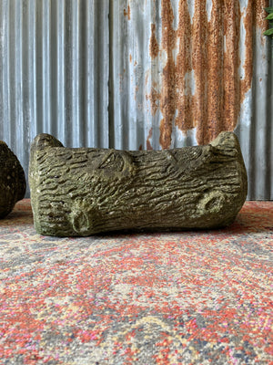 A pair of cast stone faux bois trough planters