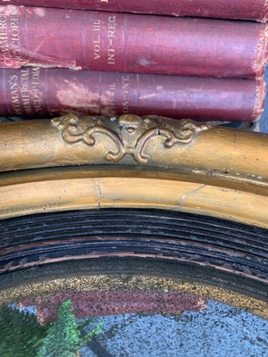 A large Regency giltwood convex mirror