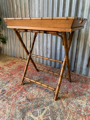 A faux bamboo butler's tray table