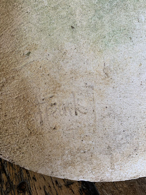 An oval cast stone plaque depicting a dog's head in profile ~C