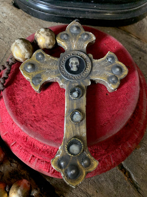 A set of oversized wooden rosary beads with memento mori motif