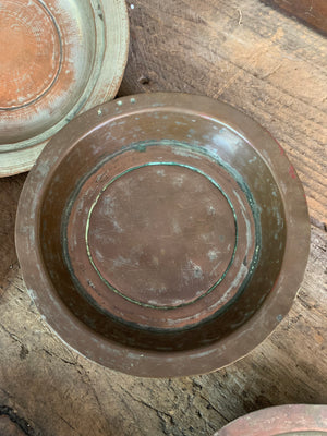 A set of six tinned copper bowls