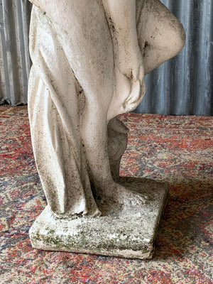 A pair of cast stone Pandora statues