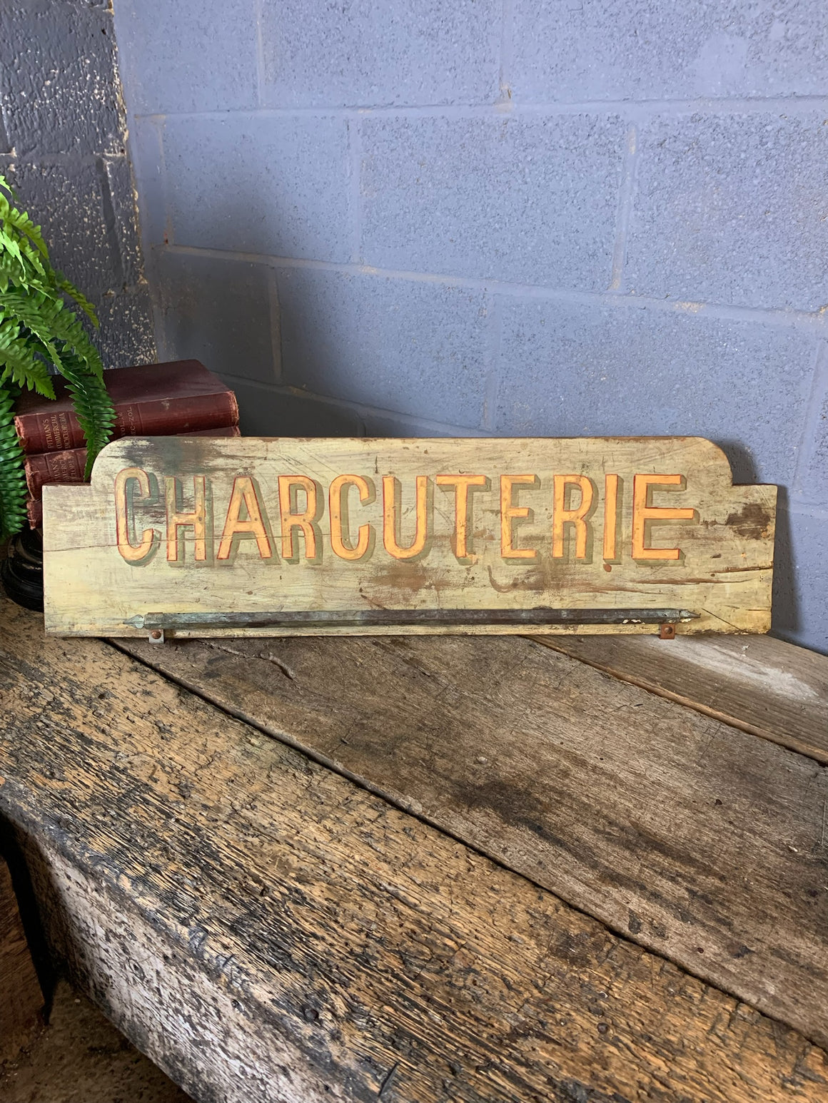 A French ‘charcuterie’ sign with hanging rack