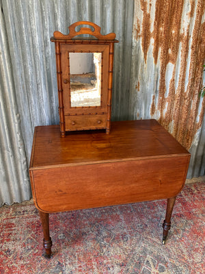 A small French faux bamboo mirrored cabinet