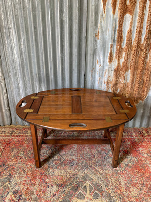 A mahogany butler's tray table