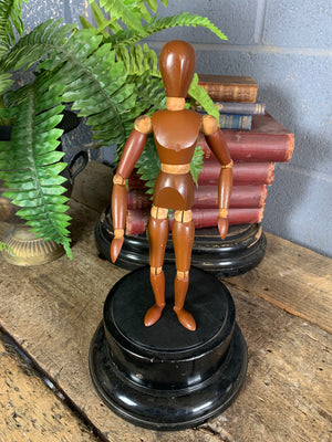 A two tone wooden artist's lay figure