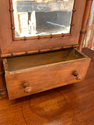 A small French faux bamboo mirrored cabinet