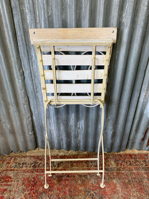 A white garden table and chairs set