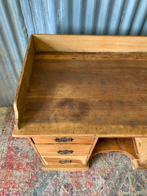 A pine clerk's desk with galleried top